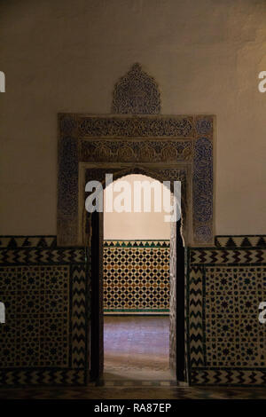 One of the numerous highly decorated doors in the interior of the Alcazar gardens in Seville, Spain Stock Photo