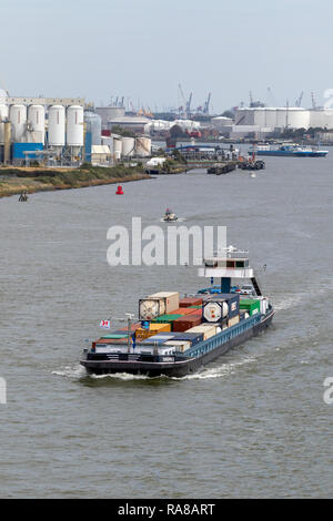 ROTTERDAM, NETHERLANDS - SEP 9, 2018: Barge transporting shipping containers on the Meuse river in the Port of Rotterdam Stock Photo