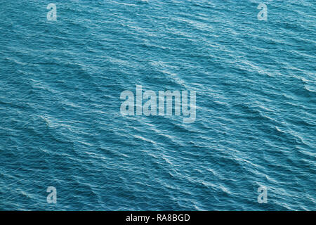 Vast blue ocean background with moderate waves looking straight down Stock Photo