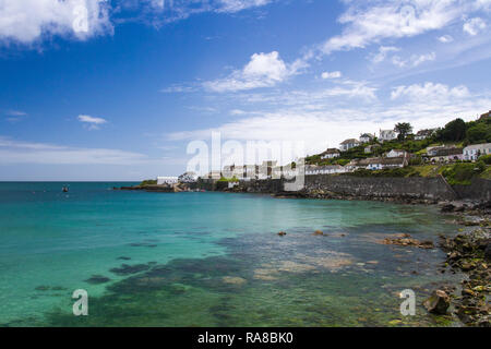 COVERACK, CORNWALL, UK - JULY 2, 2016.  A view of the headland and Dollar Point from the beach of the picturesque village of Coverack in Cornwall, UK Stock Photo