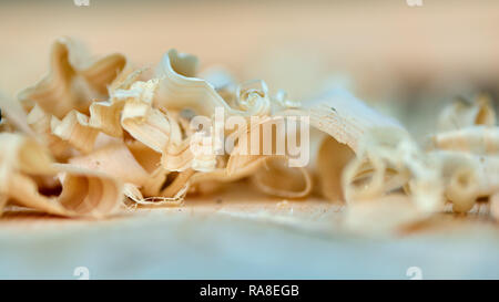 Shavings from a hand planer in closeup with selective focus Stock Photo