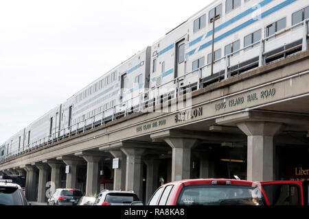 Babylon, N.Y. USA - 29 June 2017: View from street level of a double decker train at the Babylon Train Station. The words Long Island Rail Road, Stock Photo