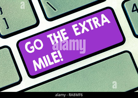 Handwriting text Go The Extra Mile. Concept meaning Give an additional do more than is expected from you Keyboard key Intention to create computer mes Stock Photo