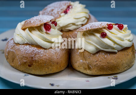 Three Semla Cakes with Cranberries on Dish Stock Photo