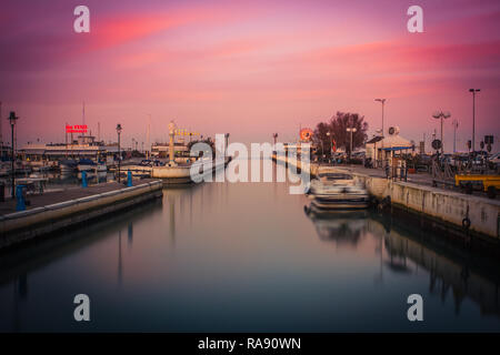 Scenic view of the Port at sunset. Long exposure picture in Riccione, Emilia Romagna, Italy. Stock Photo