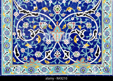 Frame of floral ceramic decoration. Colorful mosaic wallpaper. Background with islamic ornament. Mosaic blue tiles. Malaysia. Stock Photo