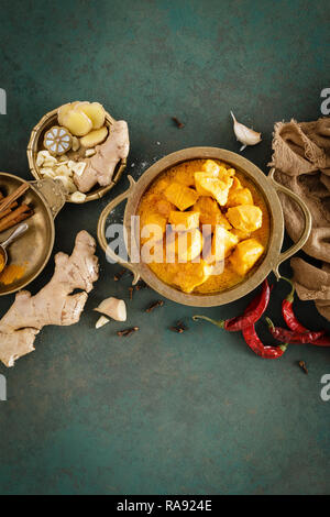 Chicken masala curry, spicy meat. Yellow chicken curry sauce. Spicy chicken curry dish. Traditional indian food, asian cuisine. Top view Stock Photo