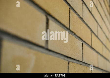 brick wall close-up yellow background for building design. construction of houses Stock Photo