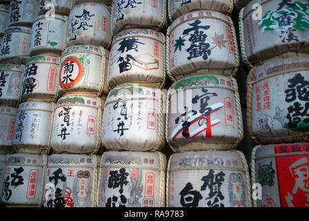 Decorated sake barrels at the entrance to the Meiji Shrine in Tokyo, Japan. Stock Photo