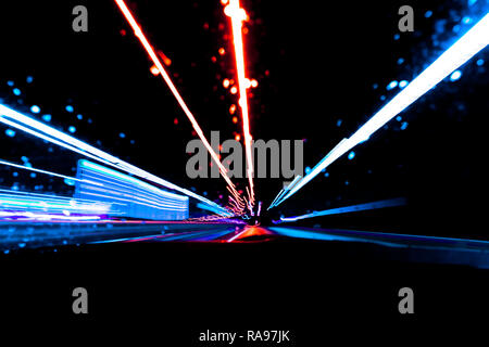 Blurred background with Cars light trails on a curved highway at night. Night traffic trails. Motion blur. Night city road with traffic headlight moti Stock Photo