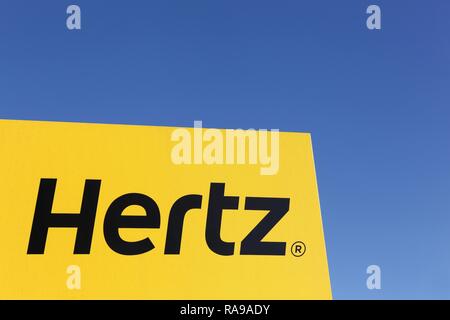 Aarhus, Denmark - February 13, 2016: Hertz logo on a panel. Hertz is an American car rental company with international locations in 145 countries Stock Photo