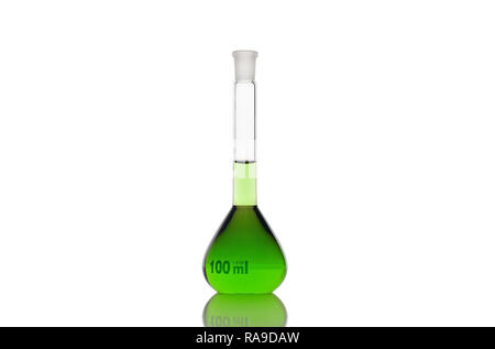 Volumetric flask with green liquid on white background Stock Photo