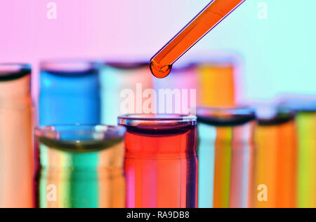Close up of chemistry test tubes with reagents and pipette Stock Photo