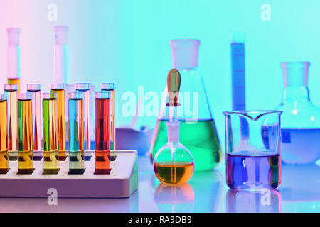 Laboratory glassware with colorful chemicals and reagents, chemistry science Stock Photo