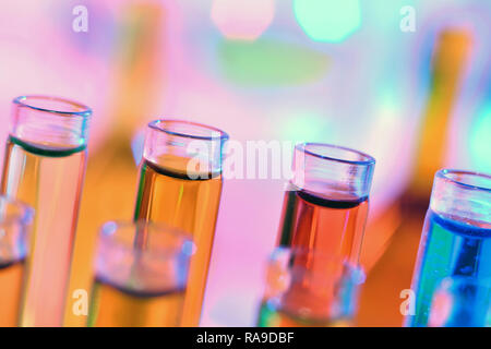 Close up of chemistry test tubes with colorful liquids and reagents Stock Photo