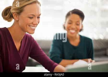 Happy colleagues working together on a project. Stock Photo