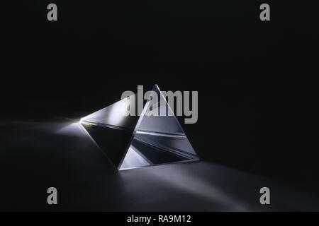 light refraction in an triangle glass prism Stock Photo