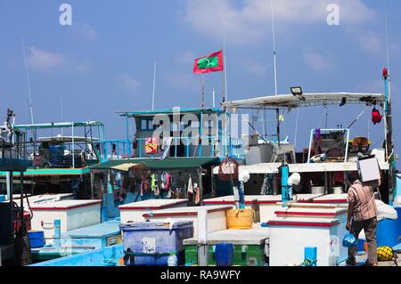 Maldivian flag over the harbor in Male fish market (Maldives, Asia) Stock Photo