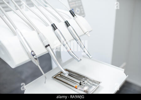 Close-up view on the professional dental instruments in the white office Stock Photo