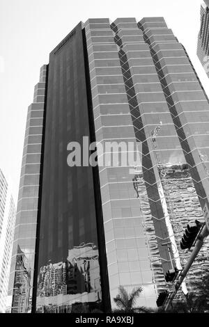 Miami, USA - October 30, 2015: tower building with glass facade on blue sky. Architecture and design. Success and future concept. Commercial property or real estate. Stock Photo