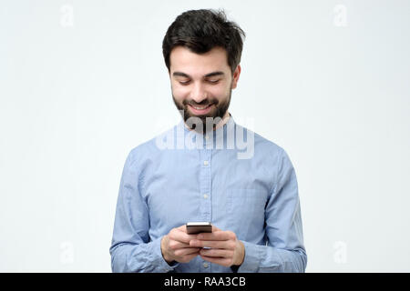 Young business man using a mobile phone Stock Photo