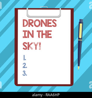 Text sign showing Drones In The Sky. Conceptual photo Aerial helicopter modern device taking pictures and video Blank Sheet of Bond Paper on Clipboard Stock Photo
