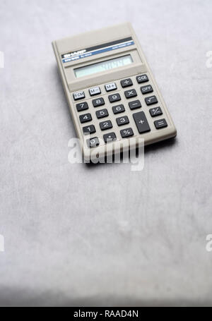 Still life of an old Sharp calculator isolated on a neutral background Stock Photo