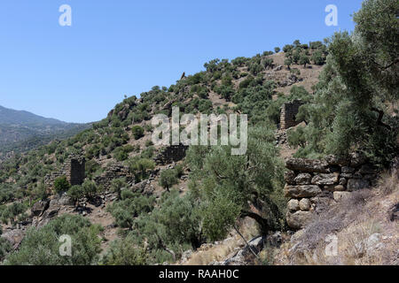 Ruins of the Hellenistic city wall and watchtower, ancient city of Alinda, Caria, Anatolia, Turkey. Stock Photo