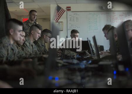 U.S. Marines with Echo Company, 2nd Battalion, 6th Marine Regiment, 2nd Marine Division (2d MARDIV), compete in the Spartan Tactical Games utilizing Virtual Battlespace 3 (VBS 3) on Camp Lejeune, N.C., Jan. 10, 2017.  VBS 3 and the Spartan Tactical Games allow the Marines to test their tactical and cognitive thinking while competing against each other on a squad level. Stock Photo