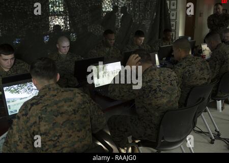 U.S. Marines with Echo Company, 2nd Battalion, 6th Marine Regiment, 2nd Marine Division (2d MARDIV), compete in the Spartan Tactical Games utilizing Virtual Battlespace 3 (VBS 3) on Camp Lejeune, N.C., Jan. 11, 2017. VBS 3 and the Spartan Tactical Games allow the Marines to test their tactical and cognitive thinking while competing against each other on a squad level. Stock Photo