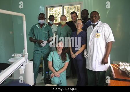 U.S. military and Senegalese medical professionals pose for a photograph with during Medical Readiness Training Exercise 17-1 at La Sante des Armees Hospital in Dakar, Senegal, Jan. 13, 2017. MEDRETE is a combined effort between the Senegalese government, U.S. Army Africa, the U.S. Army Reserve 332nd Medical Brigade in Nashville, Tenn., and the Vermont Air National Guard. AFRICOM’s MEDRETEs hosted by United States Army-Africa pair small teams of military medical professionals from the U.S. with participating African partner nations to train alongside and share best practices in trauma and surg Stock Photo