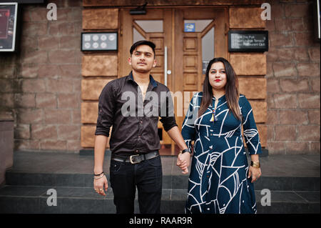 Love story of indian couple posed outdoor, sitting on bench together ...