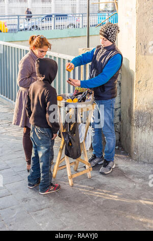 Istanbul, Turkey, January 21. 2015: Young Turkish man selling fresh mussels in a street in Aksaray. Stock Photo