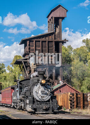 Engine #484 passes the historic coal tipple, Cumbres & Toltec Scenic Railroad, Chama, New Mexico. Stock Photo