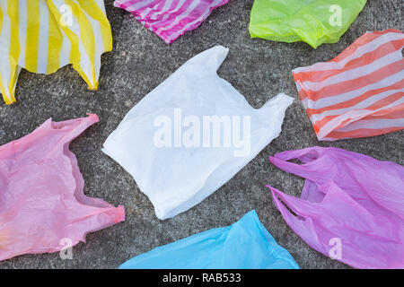 Plastic garbage bags on cement floor. Top view Stock Photo