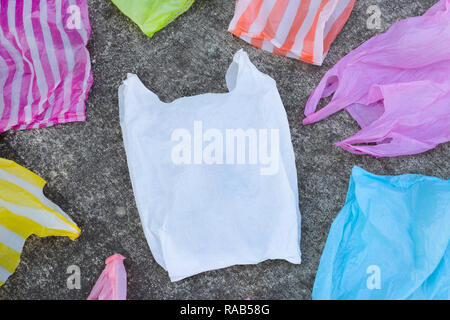 Plastic bags on cement floor background. Stock Photo