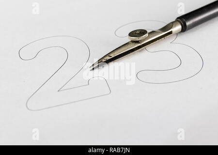 Nib for drafts on a white sheet. Drawing tools needed to draw technical drawings. Light background. Stock Photo