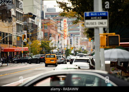 Daily life in Harlem with the famous Apollo theatre in the background. Stock Photo