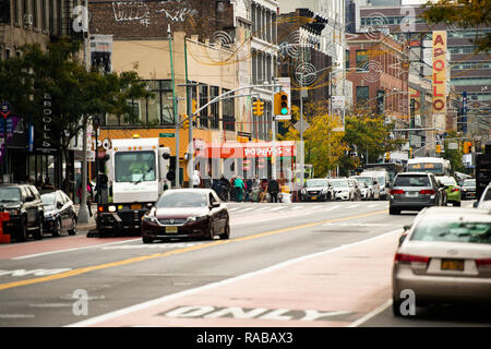 Daily life in Harlem with the famous Apollo theatre in the background. Stock Photo