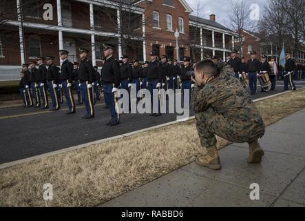 U.S. Marine Corps Lance Cpl. Cristian Ricardo, combat photographer, documents the rehearsal of the Joint Presidential Escort for the 58th Presidential Inauguration on Joint Base Meyer-Henderson Hall, Va., Jan. 12, 2017. More than 5,000 service members are providing military ceremonial support for the 58th Presidential Inauguration, a time honored tradition that dates back to 1789 when George Washington was escorted to Federal Hall in New York City to be sworn in as the first commander in chief. Stock Photo