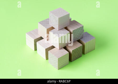 Wood cubes arranged in pattern geometric Stock Photo