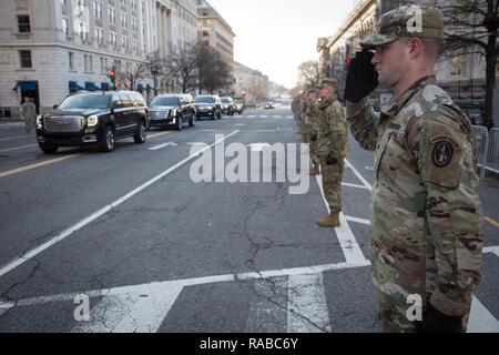 U.S. Army Sgt. Matthew Harp of the 3rd Infantry Regiment, “The Old Guard,” salutes during the Department of Defense Dress Rehearsal along Pennsylvania Ave., Washington, D.C., Jan. 15, 2017. More than 5,000 military members from across all branches of the armed forces of the United States, including Reserve and National Guard components, provided ceremonial support and Defense Support of Civil Authorities during the inaugural period. Stock Photo