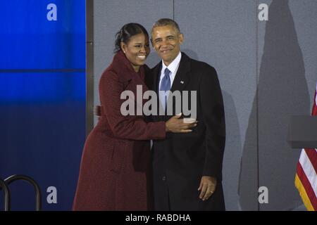 Former President Barack Obama hugs his wife Michelle after his farewell address on Joint Base Andrews, Md., Jan. 20, 2017. Throughout his eight-year tenure as president, Obama traveled to and from JBA aboard Air Force One more than 600 times, traveling around the world. Stock Photo