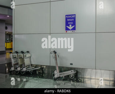 Manila, Philippines - Dec 4, 2018. Trolleys at Departure Hall of Ninoy Aquino International Airport (NAIA) in Manila, Philippines. Stock Photo