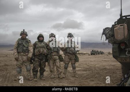 U.S. Army Soldiers assigned to the 3rd Battalion, 21st Infantry Regiment, Fort Wainwright, Alaska, pose for a group photo after a mission in a training exercise during NTC 17-03, National Training Center, Ft. Irwin, CA., Jan. 20, 2017. The National Training Center conducts tough, realistic, Unified Land Operations with our United Action Partners to prepare Brigade Combat Teams and other units for combat while taking care of Soldiers, Civilians, and Family members. Stock Photo