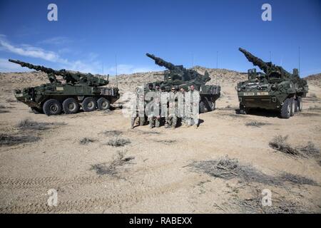 U.S. Army Soldiers assigned to the 1st Cavalry Regiment, 1/25 SBCT 'Arctic Wolves' pose for a group photo as this is the last mission for 19 kilos, National Training Center, Ft. Irwin, CA., Jan. 18, 2017. The National Training Center conducts tough, realistic, Unified Land Operations with our United Action Partners to prepare Brigade Combat Teams and other units for combat while taking care of Soldiers, Civilians, and Family members. Stock Photo