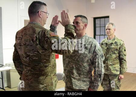 76th Division (OR) Commanding General, Maj. Gen. Ricky Waddell, promoted Chaplain Assistant Sgt. 1st Class Todd Parry at his current rank, during the unit’s battle assembly January 21 at Fort Douglas, Utah. Stock Photo