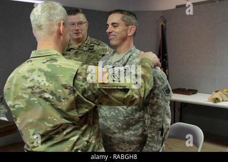 76th Division (OR) Commanding General, Maj. Gen. Ricky Waddell, promoted Chaplain Assistant Sgt. 1st Class Todd Parry at his current rank, during the unit’s battle assembly January 21 at Fort Douglas, Utah. Stock Photo