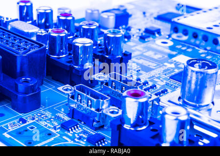 Circuitboard with resistors, microchips and electronic components. Electronic computer hardware technology. Integrated communication processor. Inform Stock Photo