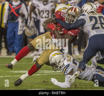 Santa Clara, California, USA. 20th Dec, 2014. San Diego Chargers cornerback Brandon Flowers (26) and strong safety Marcus Gilchrist (38) team up to tackle San Francisco 49ers running back Frank Gore (21) on Saturday, December 20, 2014, at Levis Stadium in Santa Clara, California. The Chargers defeated the 49ers 38-35 in overtime. Credit: Al Golub/ZUMA Wire/Alamy Live News Stock Photo